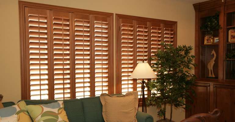 Wood shutters in Tampa living room.